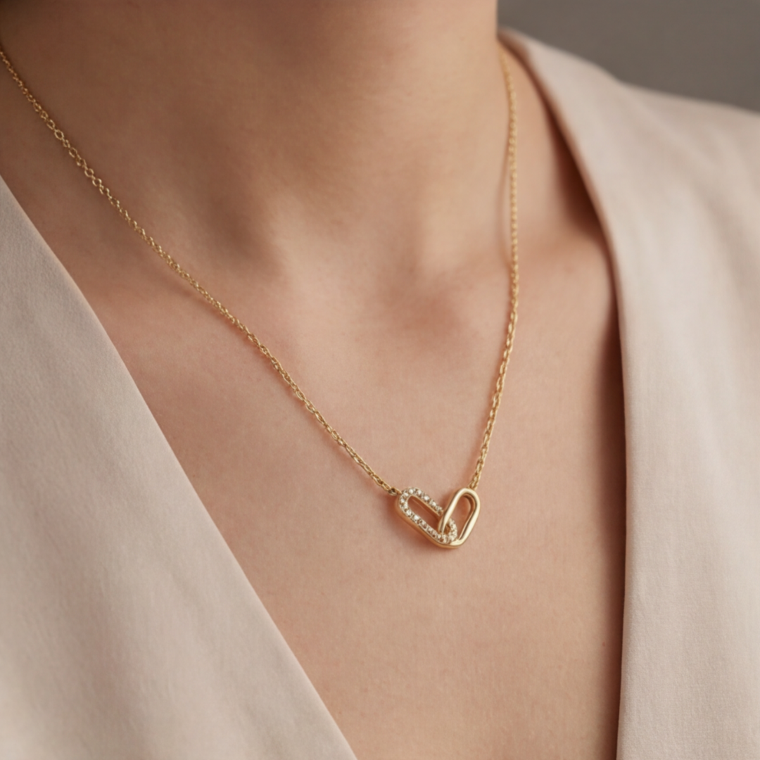 GOLD-COLOURED NECKLACE WITH CURVED PENDANT