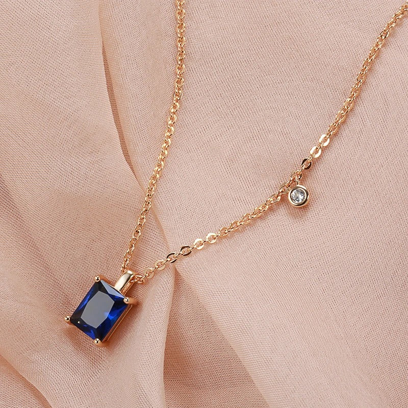 GOLD-COLOURED NECKLACE WITH BLUE ZIRCONIA