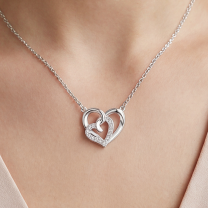 SILVER-COLOURED NECKLACE WITH HEART SYMBOLS